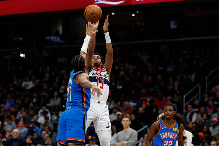 Washington Wizards guard Jordan Poole (13) shoots the ball over Oklahoma City Thunder guard Aaron Wiggins (21) in the third quarter at Capital One Arena.